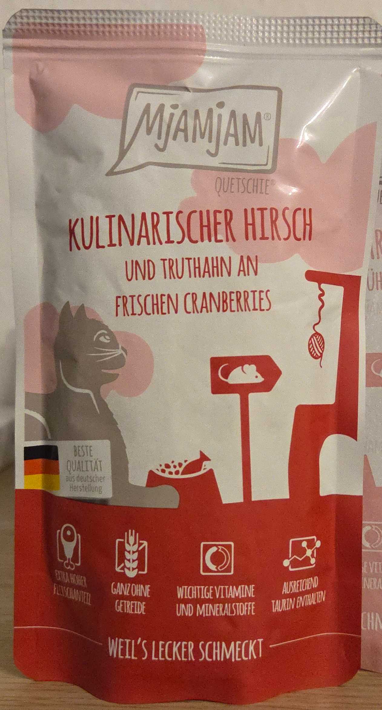 Kulinarischer Hirsch und Truthahn an frischen Cranberries